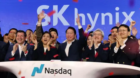 Getty Images Chey Tae-won, chairman of SK Group, center, and Kwak Noh-jung, president and CEO of SK Hynix Inc., center left, ring the opening bell during the company's IPO at the Nasdaq in New York, US, on Friday, July 10, 2026.