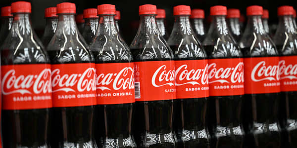 Coca-Cola earnings, Altman in D.C., Apple's market cap milestone and more in Morning Squawk