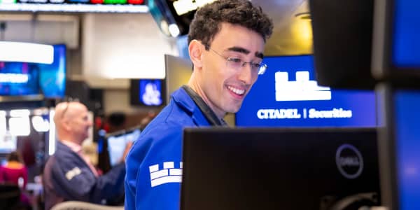 Dow jumps nearly 600 points to record close; Nasdaq slides as chip stocks suffer: Live updates