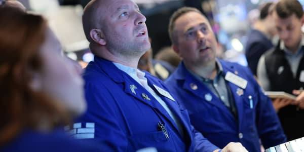 Dow closes little changed after touching record; Nasdaq slides to start July