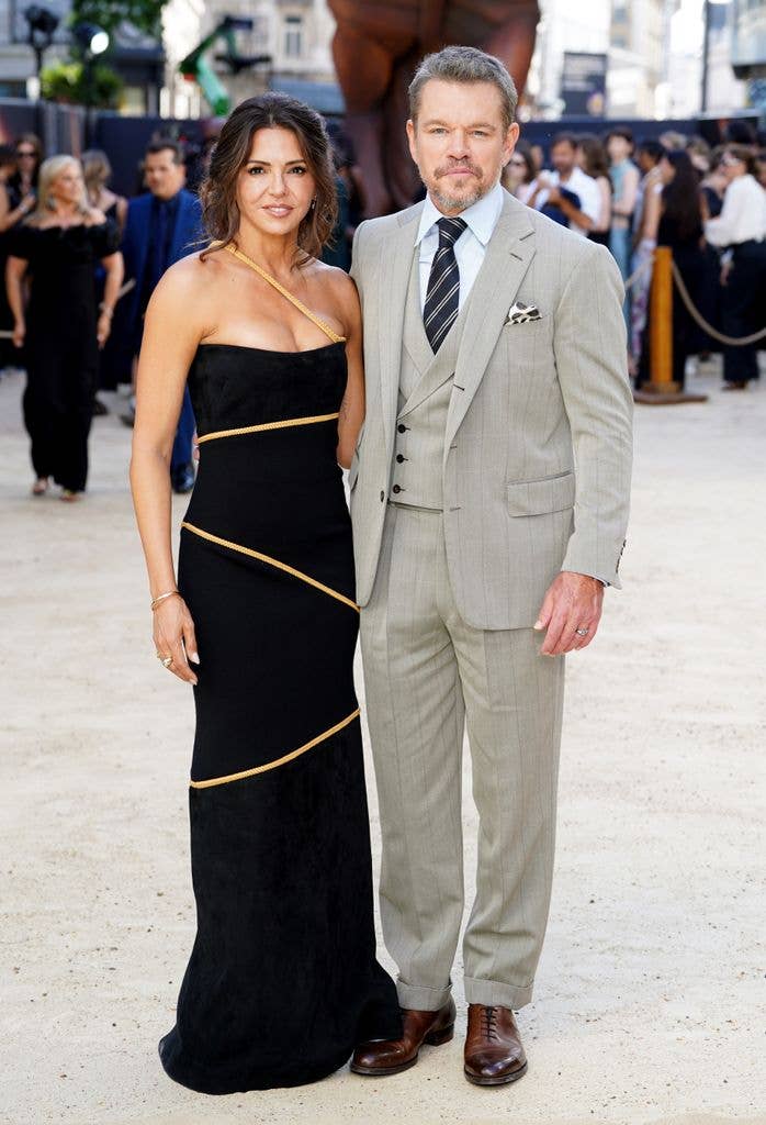 photo of matt damon with wife on red carpet