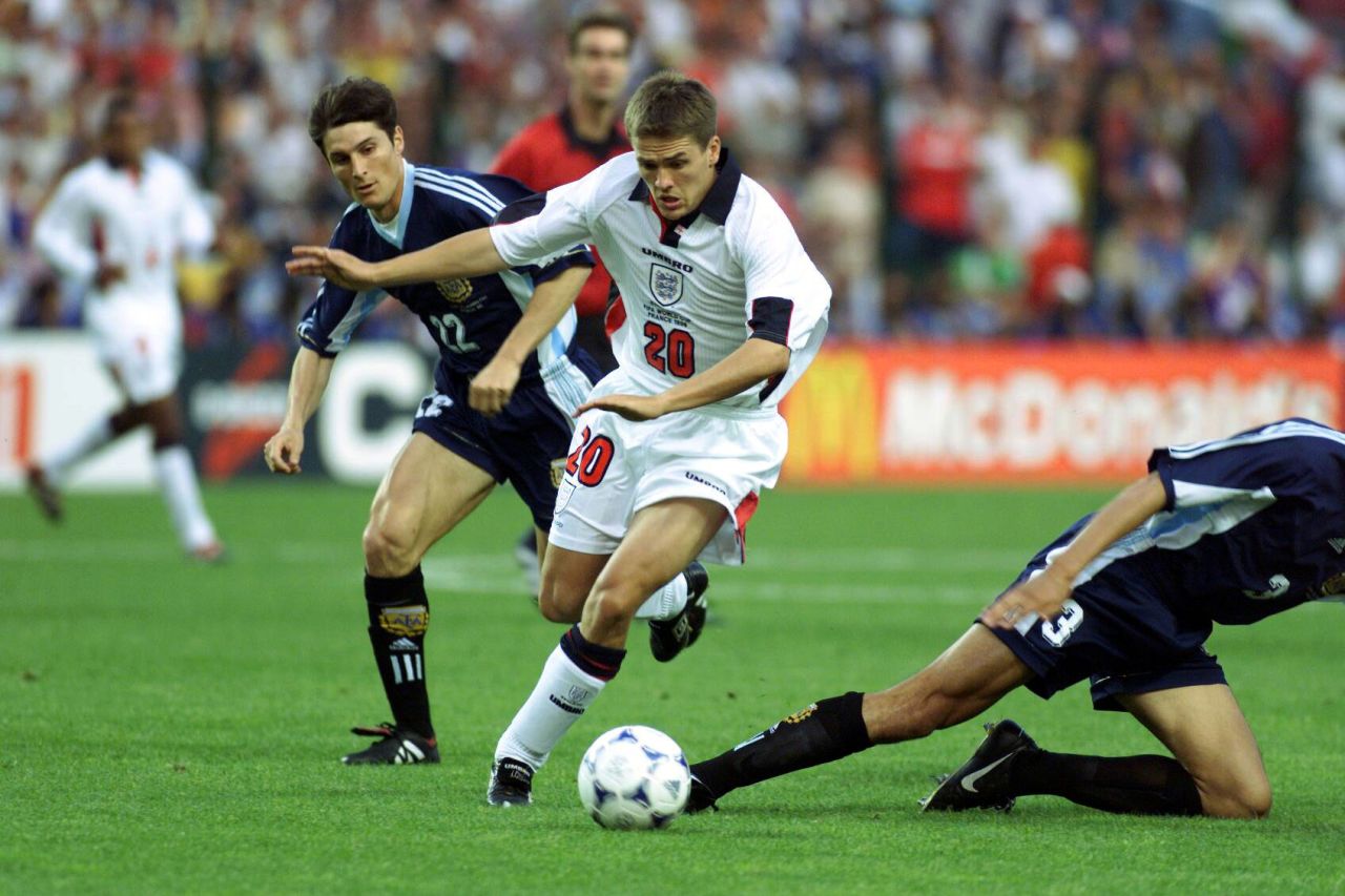 Michael Owen dribbles past Argentina's José Chamot during the World Cup in 1998.