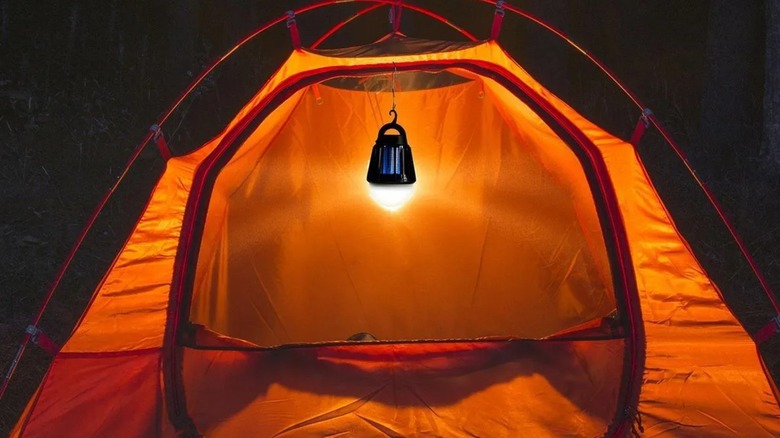 bug zapper/light hanging in a tent