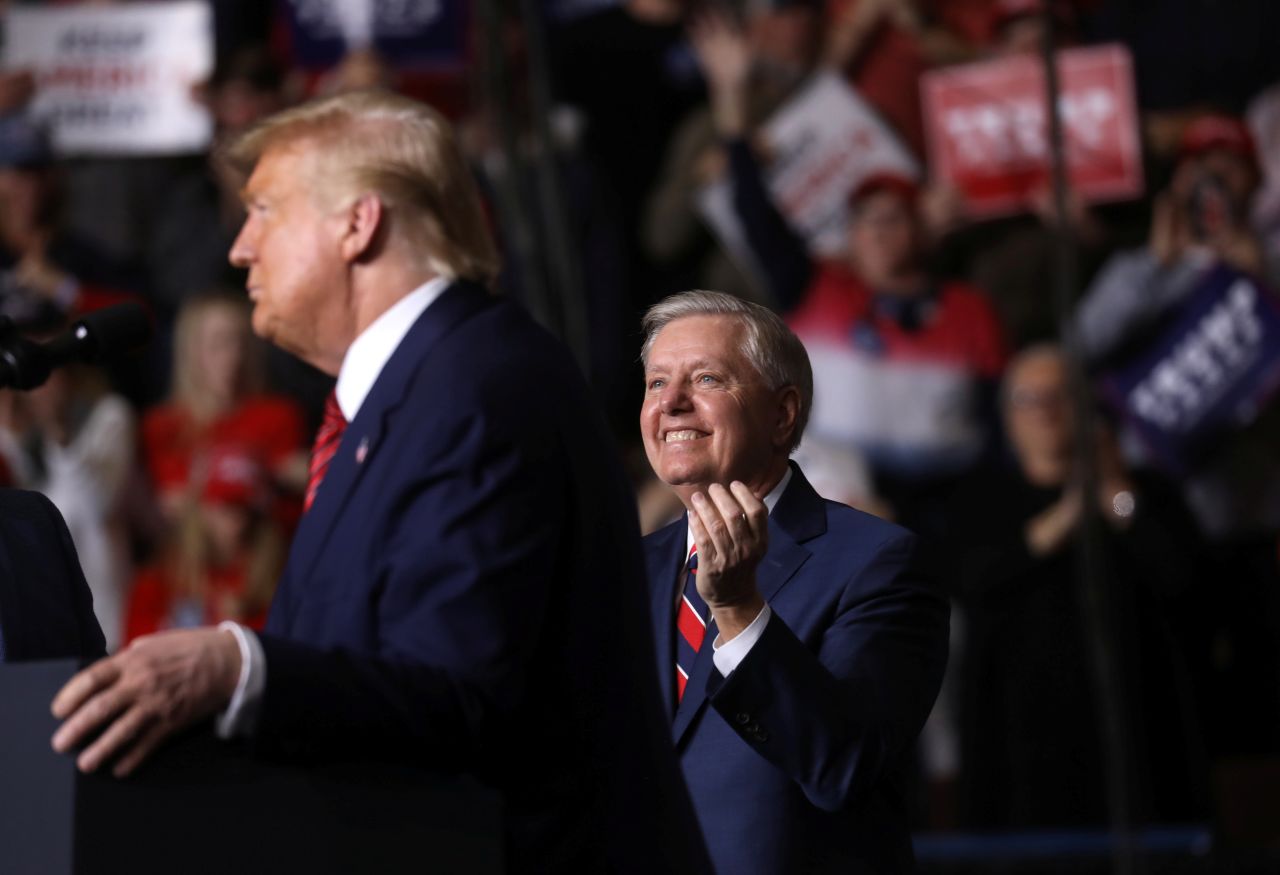 Republican Sen. Lindsey Graham applauds as US President Donald Trump holds a campaign rally in North Charleston, South Carolina, February 28, 2020.