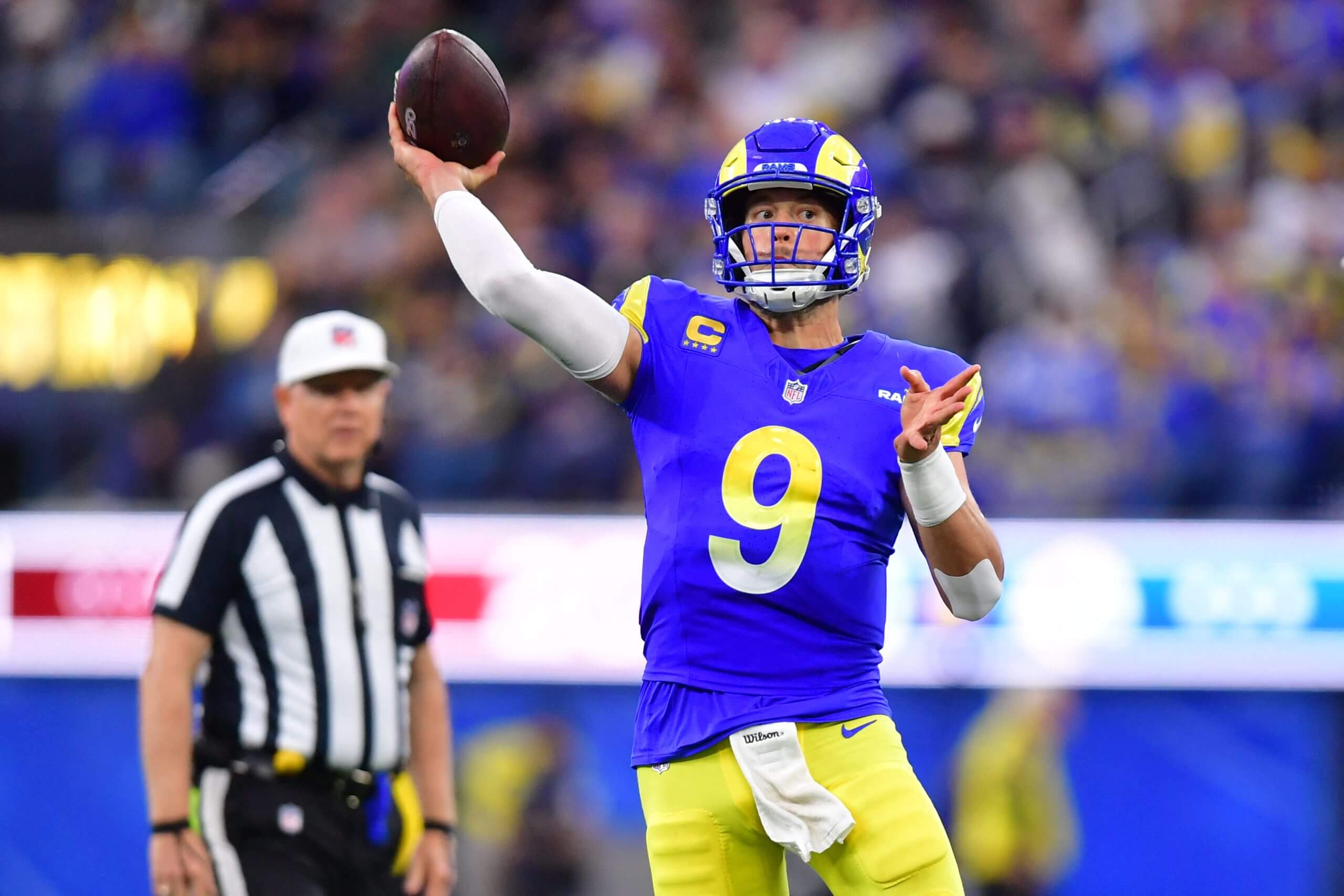 Los Angeles Rams quarterback Matthew Stafford (9) throws downfield against the Arizona Cardinals during the second half at SoFi Stadium.