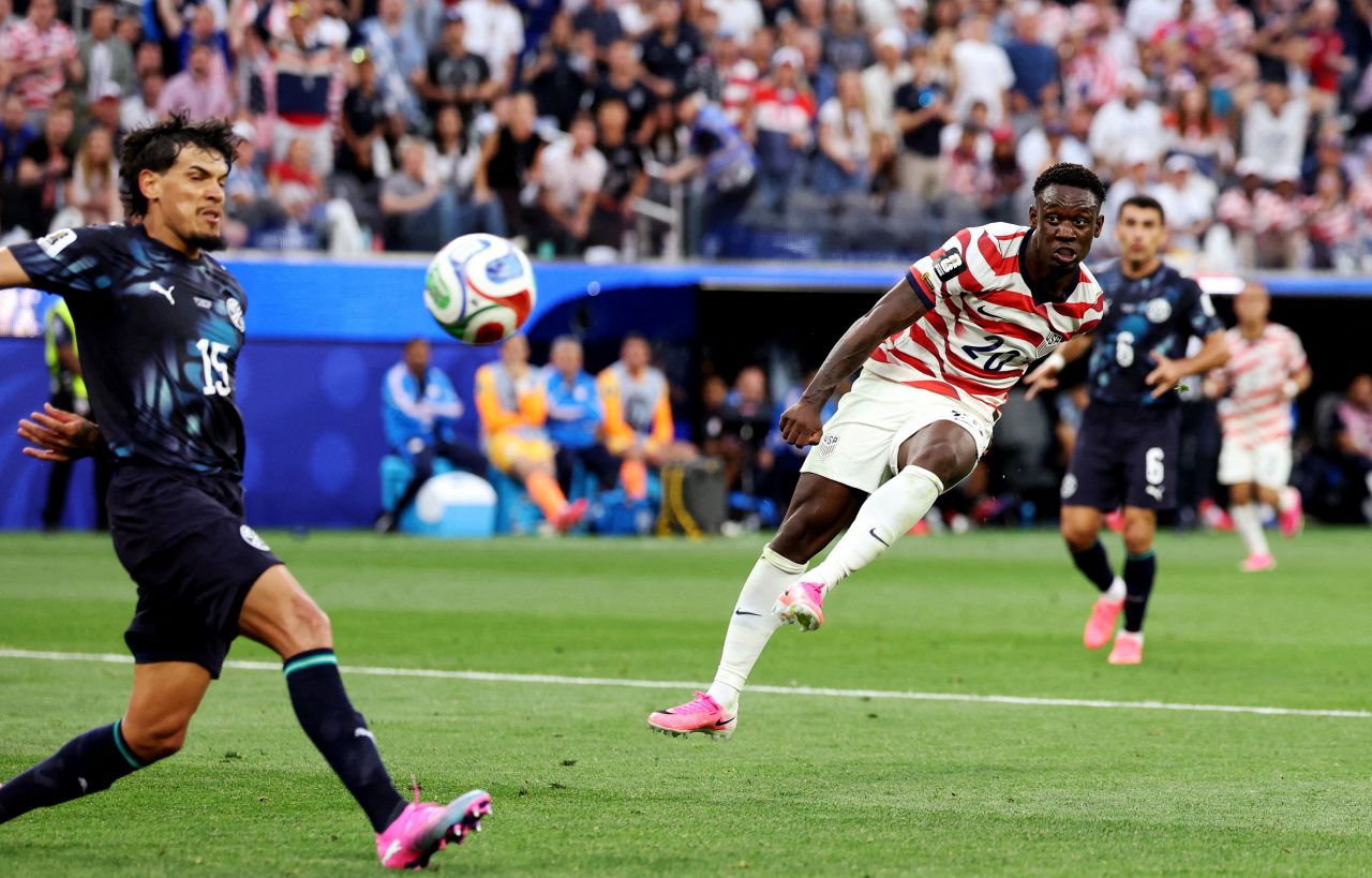 American striker Folarin Balogun scores a goal against Paraguay in the group stage.