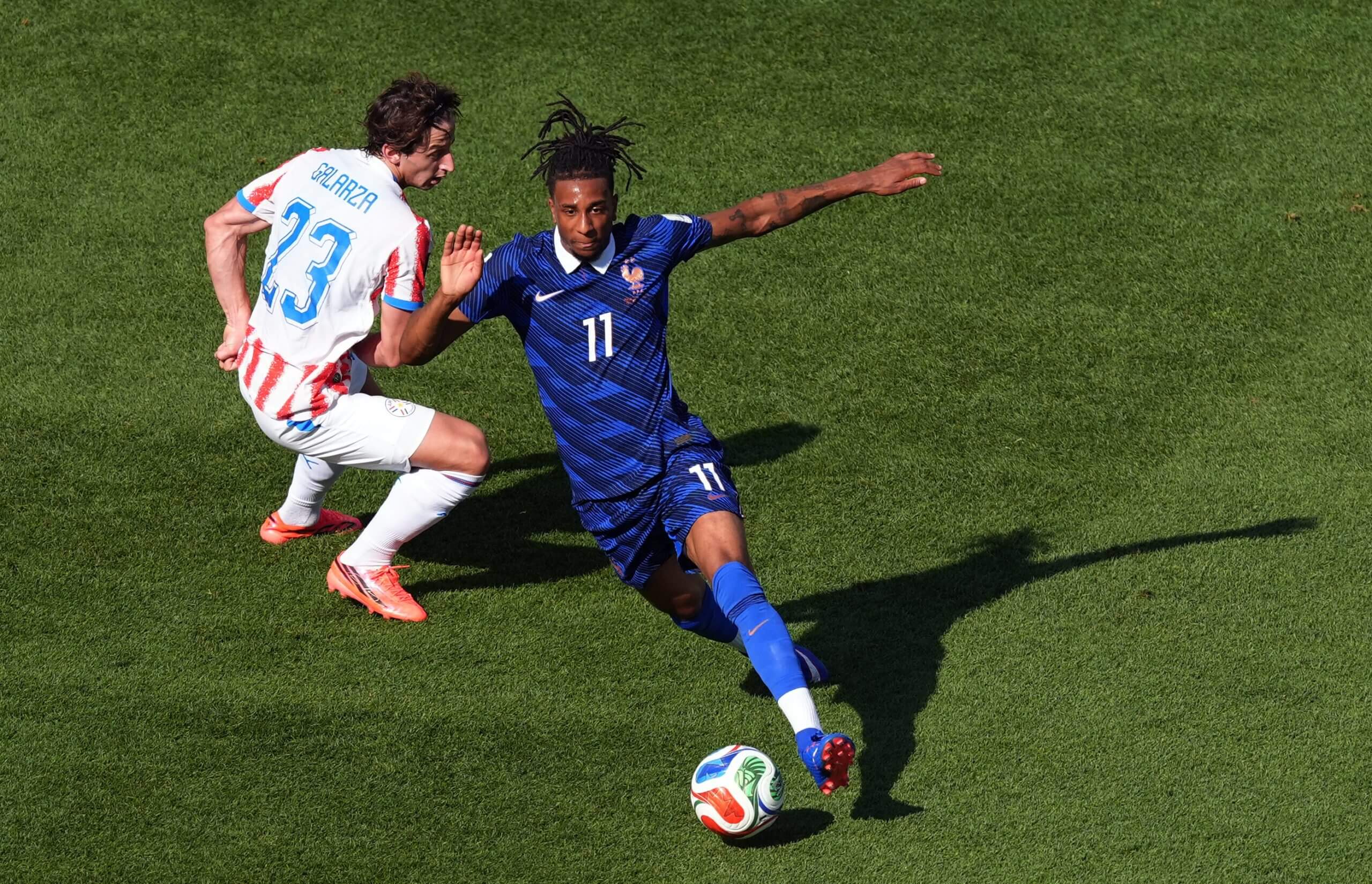 France's Michael Olise glides past Paraguay's Matias Galarza