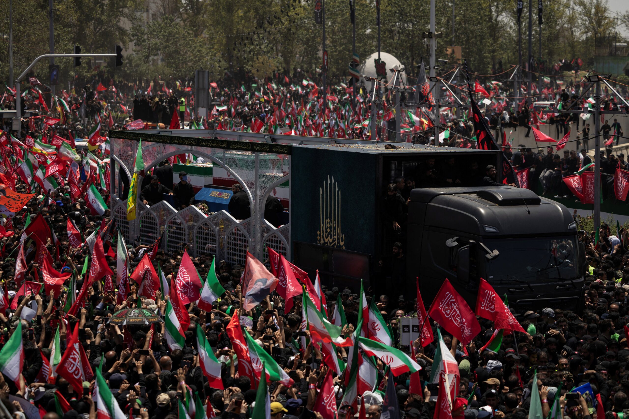 A vehicle carrying the coffins of Iran's late Supreme Leader Ayatollah Ali Khamenei and members of his family