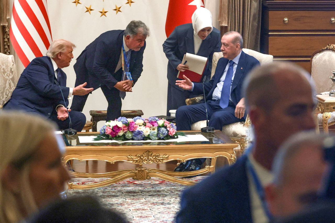 US President Donald Trump and Turkish President Tayyip Erdogan speak with their translators during a meeting ahead of their participation in a NATO summit, as members of the media leave the room at the Bestepe Presidential Compound in Ankara, Turkey, on Tuesday.