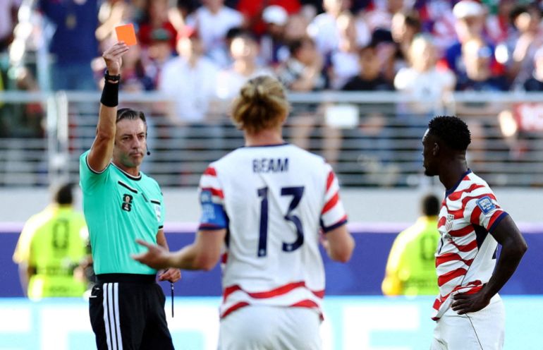 Folarin Balogun of the USA is shown a red card that did not result in a ban for the following game