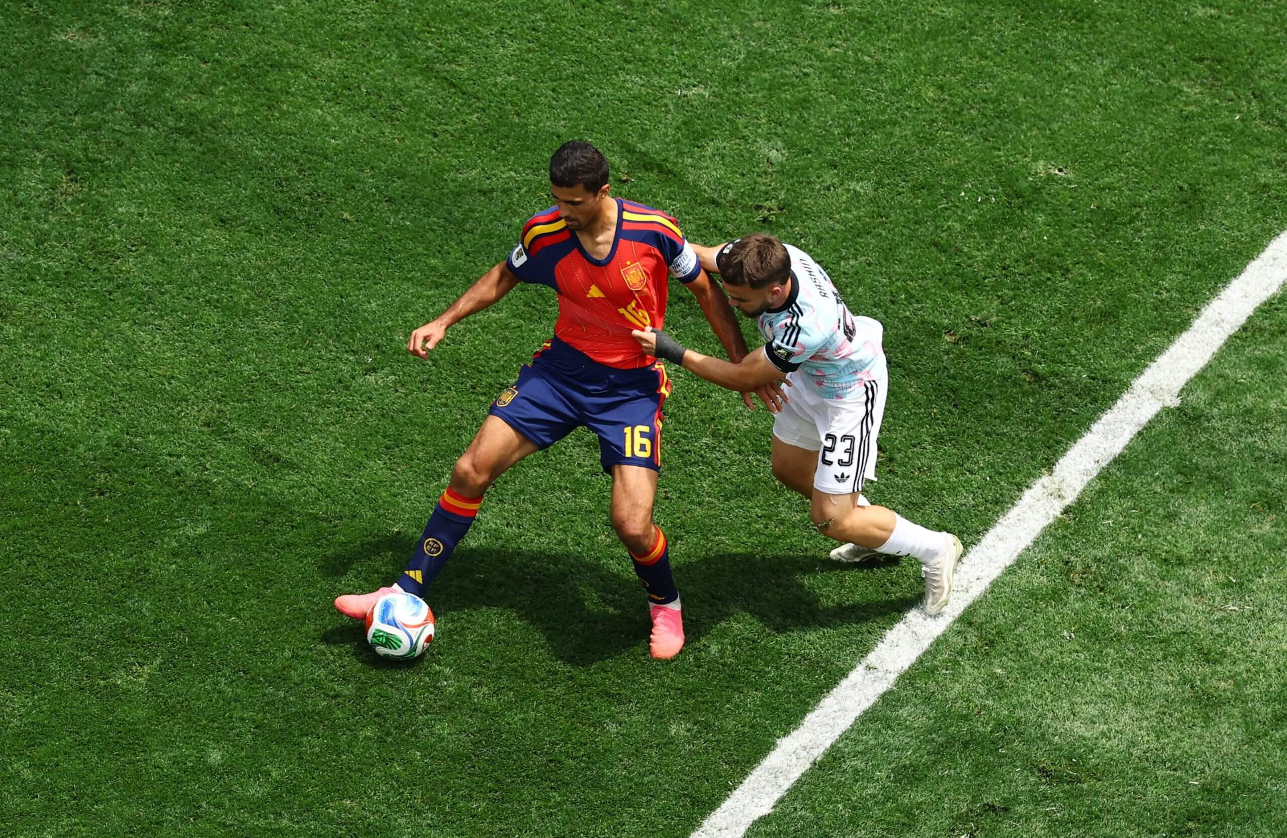 Spain's Rodri protects the ball from Belgium's Nico Raskin