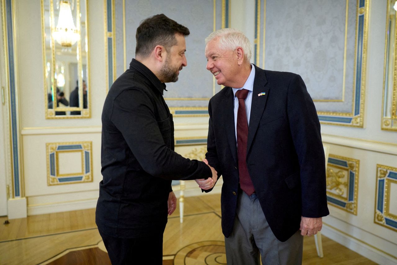 Ukraine's President Volodymyr Zelenskiy welcomes US Senator Lindsey Graham before their meeting, in Kyiv, on July 10.