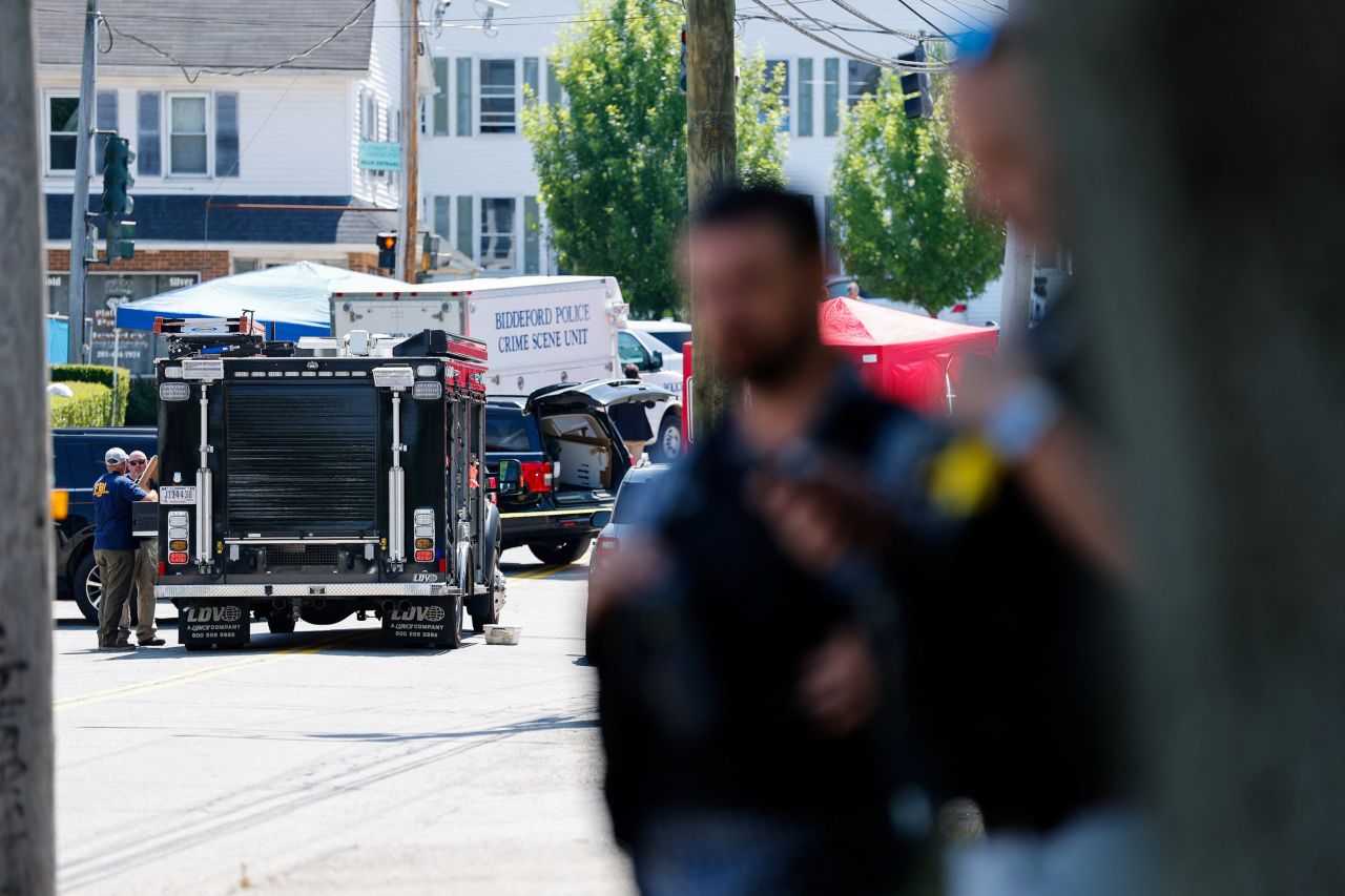 FBI agents work at a scene of a shooting involving US Immigration and Customs Enforcement in Biddeford, Maine, on Monday.