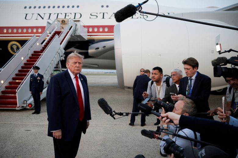 US President Donald Trump speaks with the media as he arrives at Joint Base Andrews in Maryland, on July 19, 2026.
