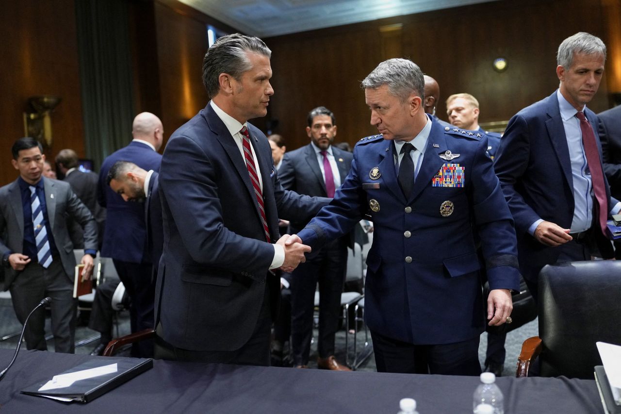 Secretary of Defense Pete Hegseth shakes hands with Chairman of the Joint Chiefs of Staff General Dan Caine at the end of a Senate Appropriations Committee hearing on President Donald Trump's supplemental funding request for the Department of Defense, in Washington, DC, on Tuesday, July 21.