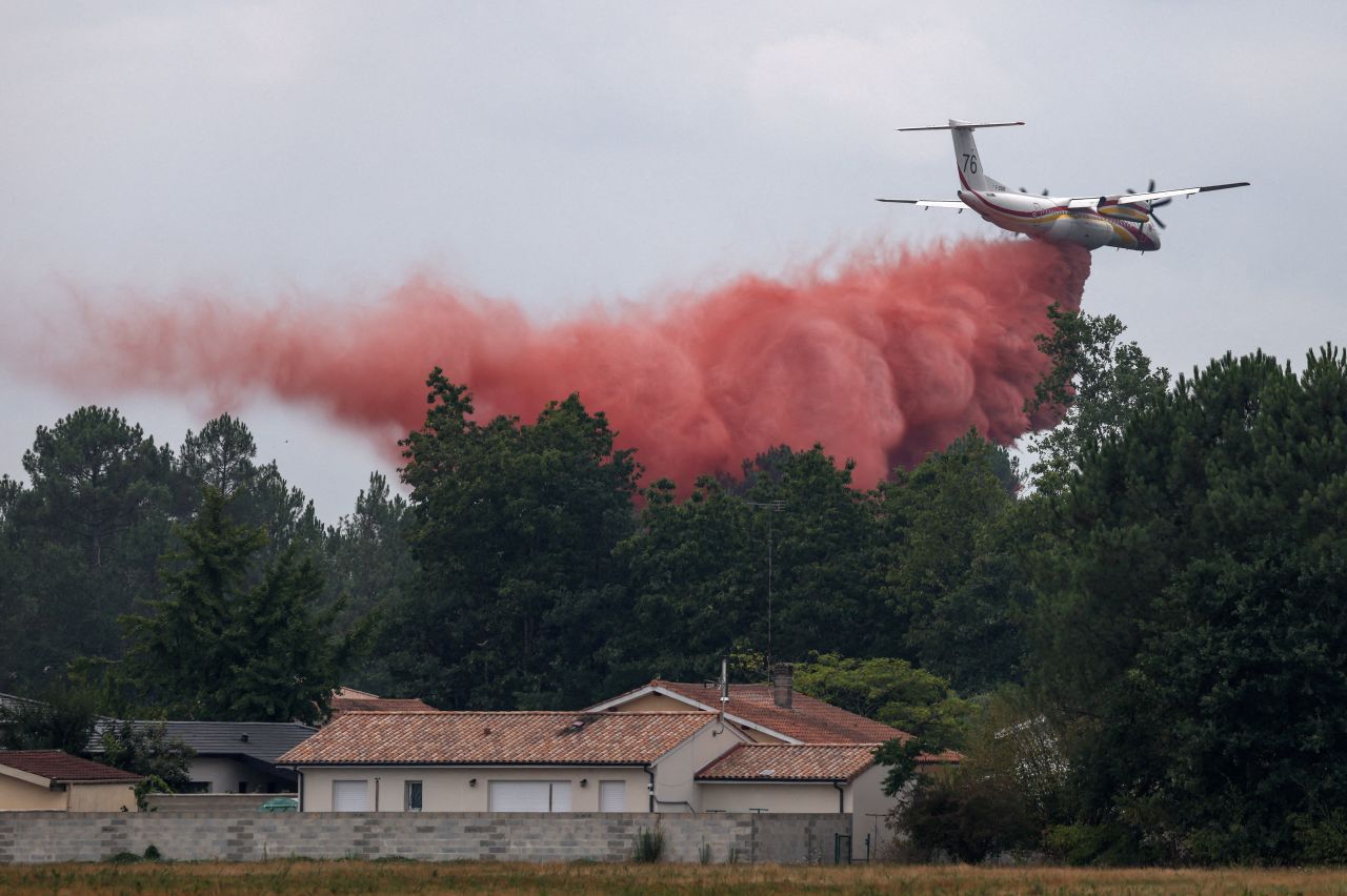 A plane drops fire retardant in Marcheprime, France, on Monday.