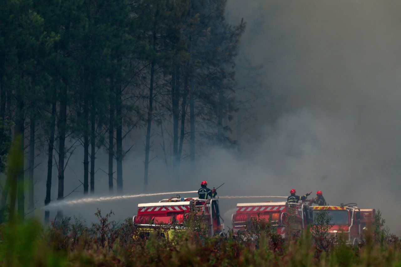 Firefighters battle wildfires amid drought conditions following a heatwave and water shortages across much of France, in Saint-Jean-d'Illac, Gironde department, France.