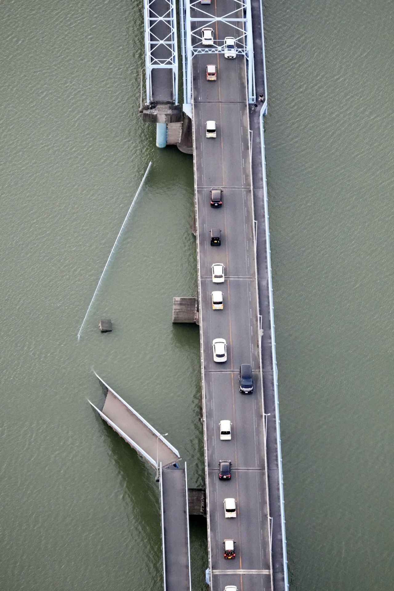 A collapsed section of a bridge is seen in Kumamoto.