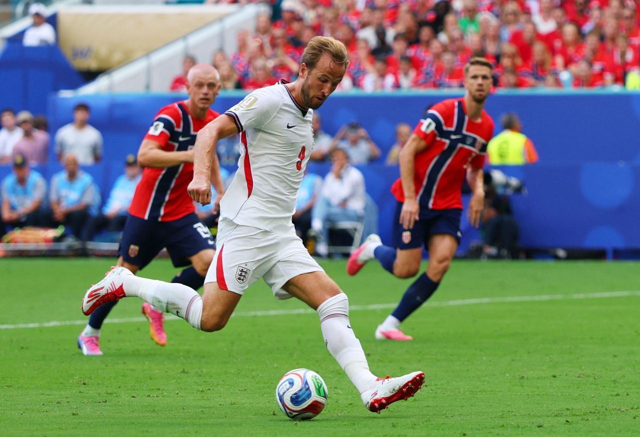 England's Harry Kane shoots his team's second goal before it was disallowed for being offside.