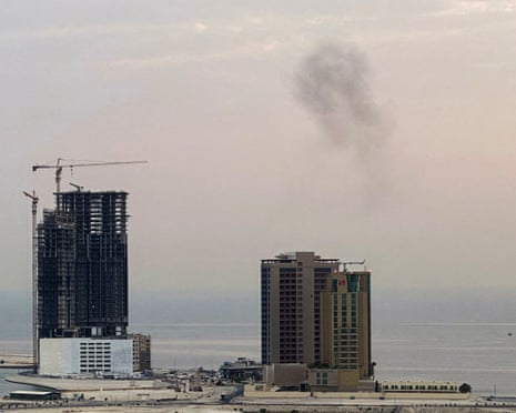 Smoke rises after a drone was intercepted in the early hours of Tuesday in Manama, Bahrain
