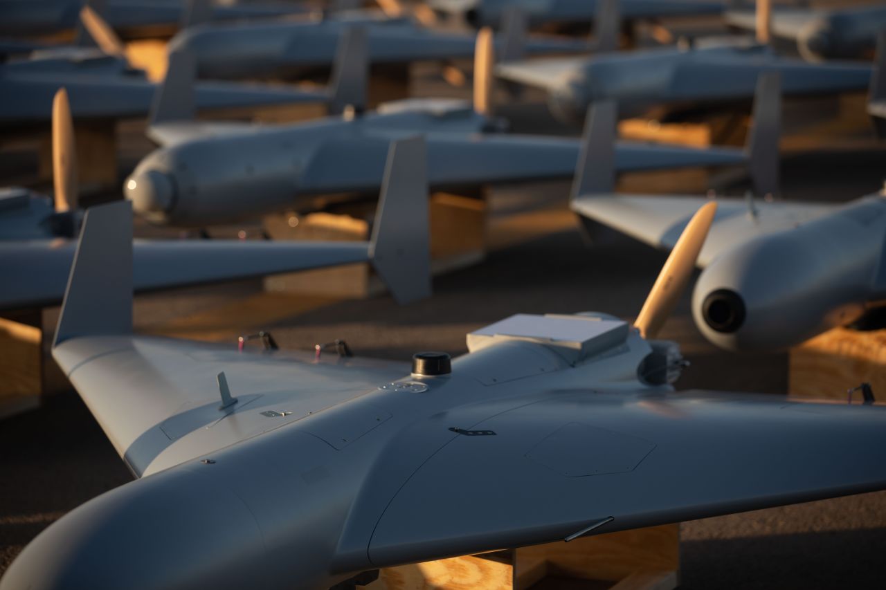 Low-cost Unmanned Combat Attack System (LUCAS) drones are positioned on the tarmac at a base in the U.S. Central Command (CENTCOM) operating area, on November 25, 2023.