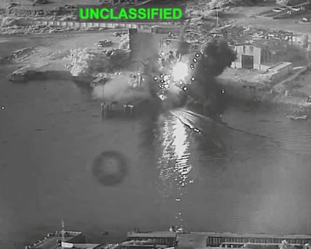 Smoke rises after a US one-way attack surface drone reached its target, a submarine and ship maintenance facility according to U.S. Central Command, in Bandar Abbas, Iran, in this screengrab taken from a video.