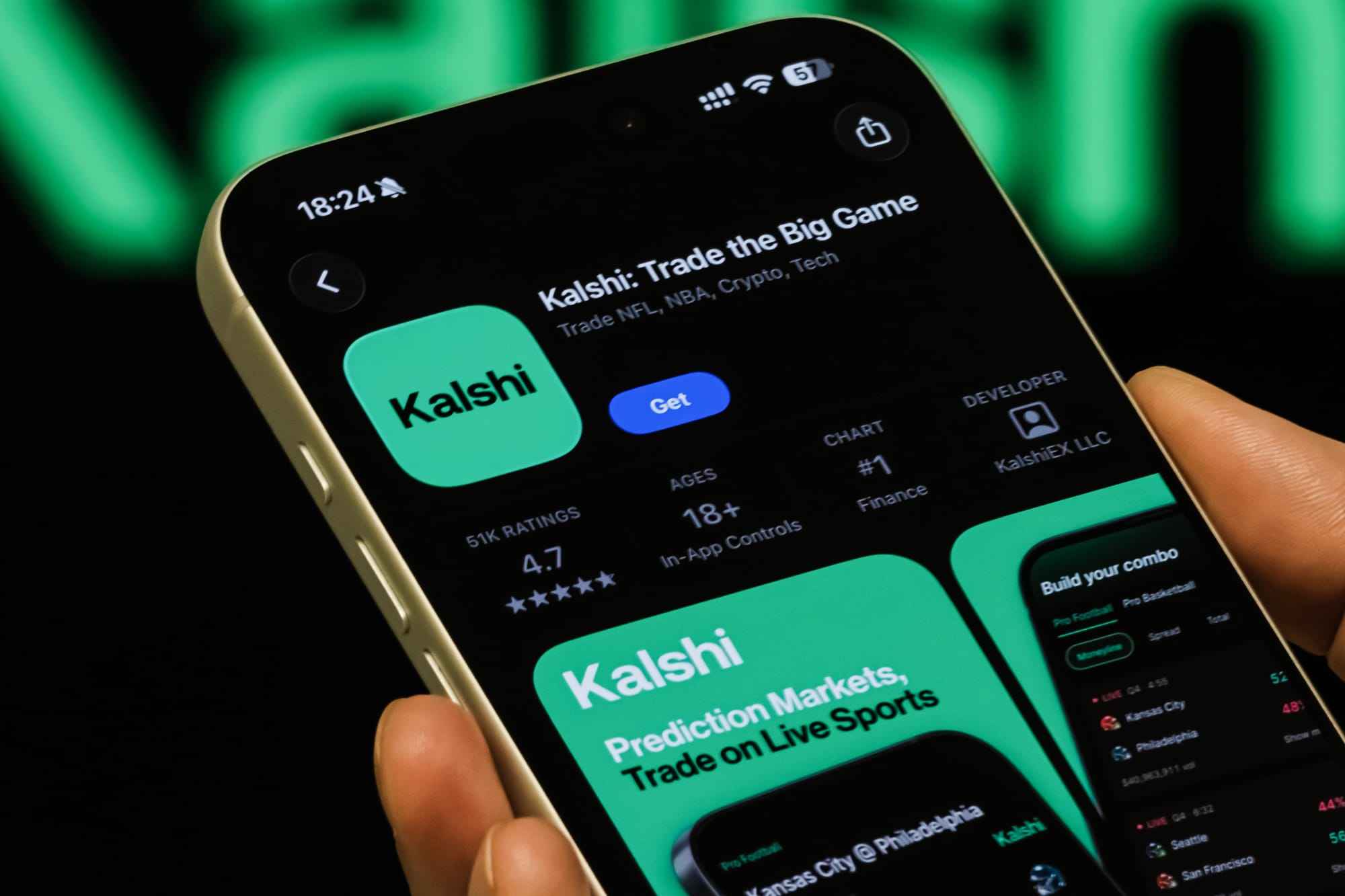 Kalshi App Page Shown On Smartphone With Kalshi Branding In Background