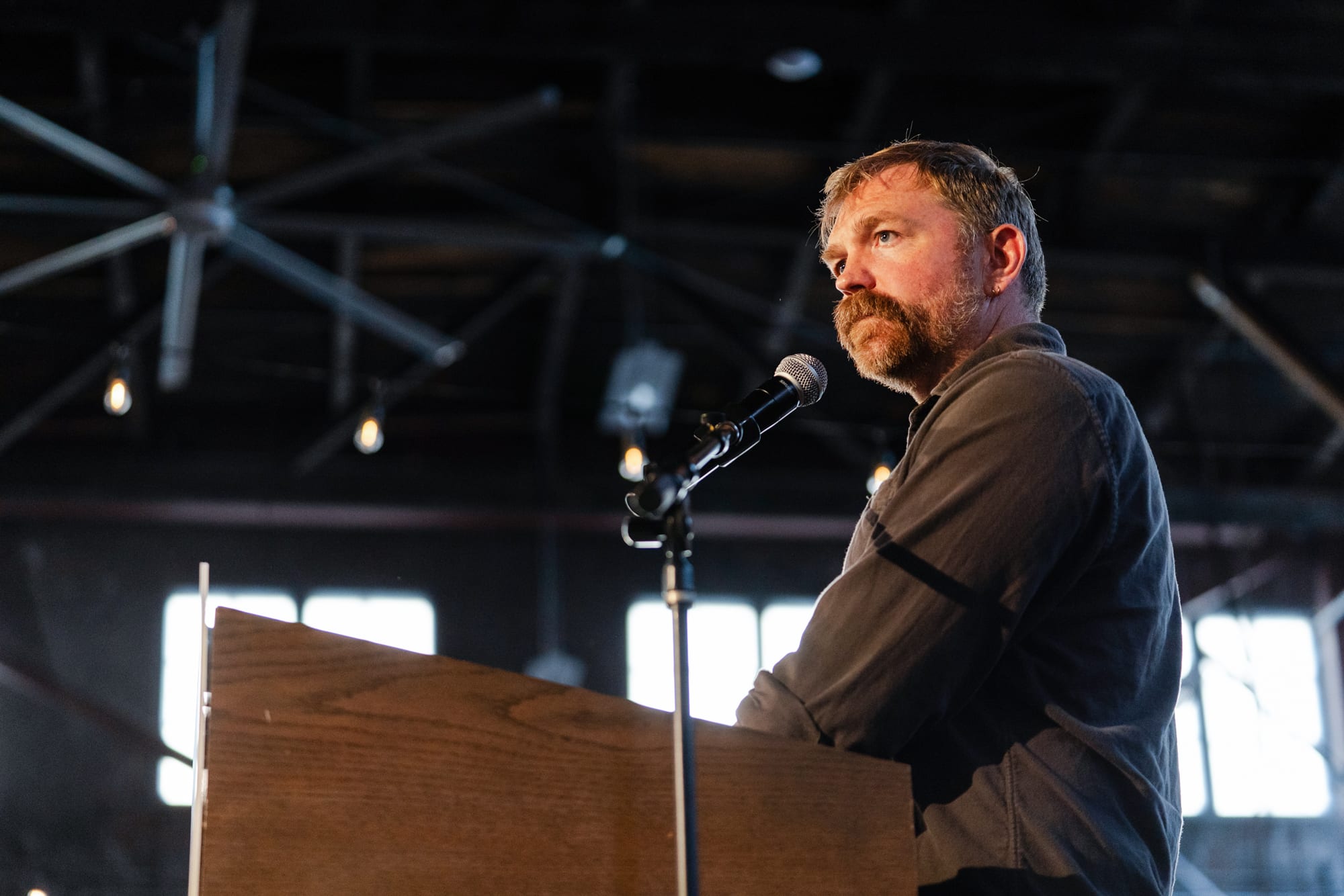 Graham Platner stands at a podium