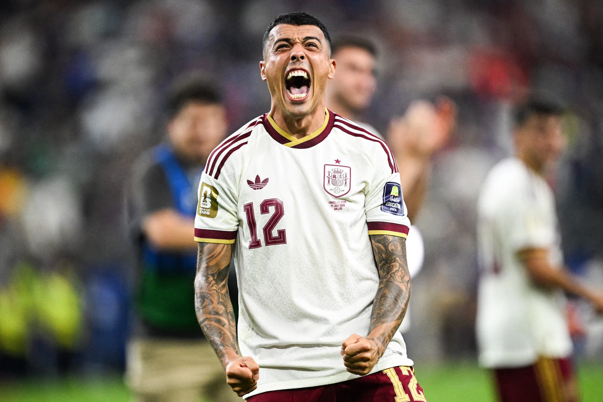 Pedro Porro yells in celebration on the soccer field