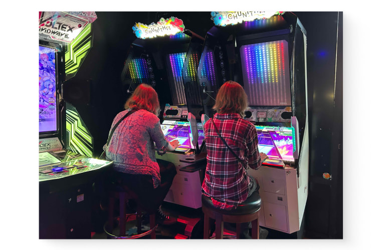 Emi and May at the arcade.
