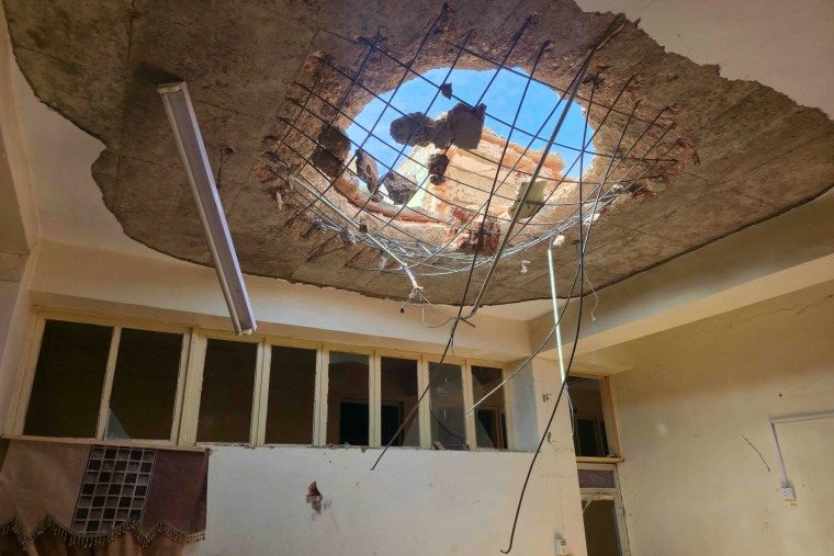 a damaged interior view of the Agricultural Bank of Sudan after an attack.