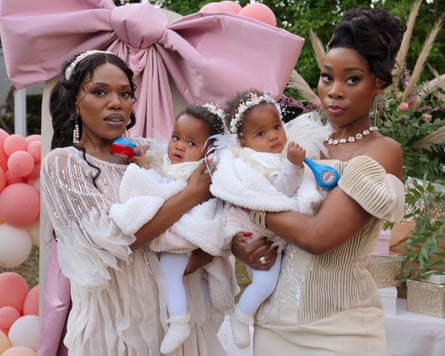 Two women holding babies