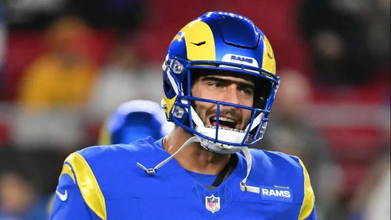 Jimmy Garoppolo #11 of the Los Angeles Rams warms up before a game against the Minnesota Vikings during the NFC Wild Card Playoff.