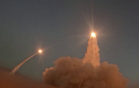 Two missiles in the sky.