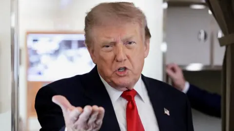 Reuters US President Donald Trumps speaks to reporters aboard Air Force One. Photo: 27 July 2026
