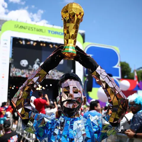 FIFA via Getty Images  A man in a Lionel Messi costume greats fans before the 2026 FIFA World Cup Final between Spain and Argentina during the FIFA Fan Festival at Fort York & The Bentway on July 19, 2026 in Toronto