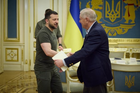 two men shaking hands in office