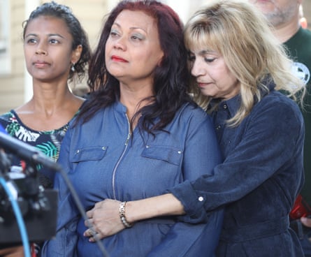 a woman hugging another woman