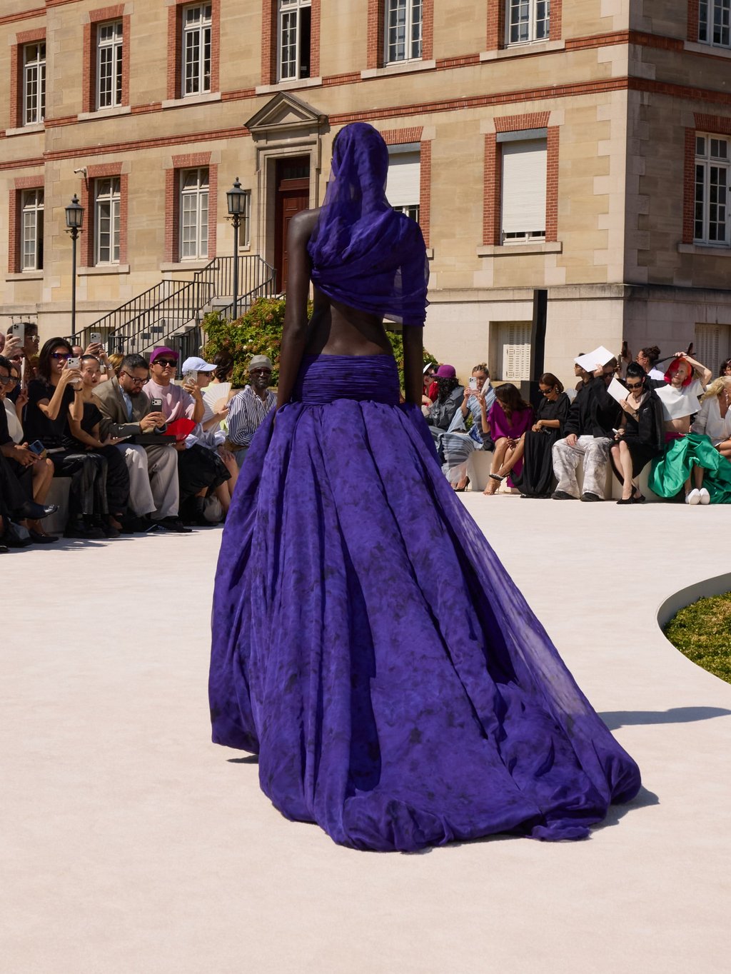 A hooded dress in purple chiffon at Balenciaga. Photo: Handout