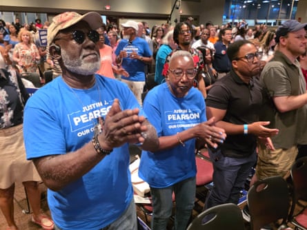 a group of people clapping their hands