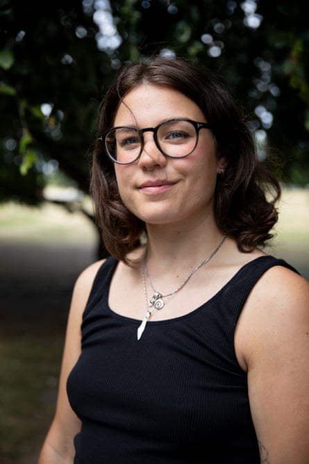 Portrait of Anna Liedtke wearing a black dress and a Palestine necklace