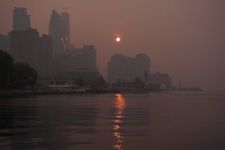 A sun rising over water.
