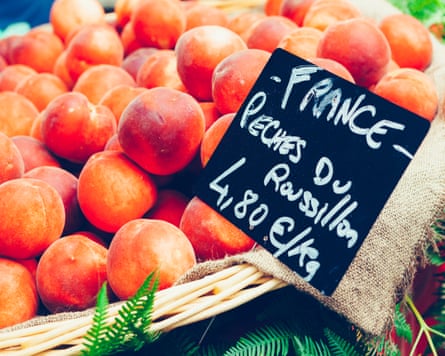 Peaches for sale at an outdoor market at Chauvigny, France.