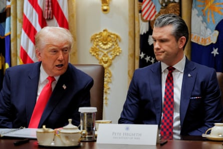 The US president, Donald Trump, left, and his secretary of defense, Pete Hegseth, sit next to one another in a meeting room at the White House