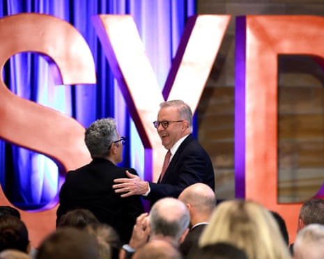 Anthony Albanese greets someone in the audience  after his speech on AI at the University of Sydney