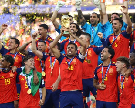 Spain, wearing their winners’ medals, celebrate as captain Rodri lifts the World Cup