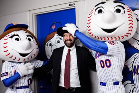 Man with baseball mascots