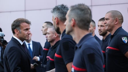 Emmanuel Macron with firefighters on a visit to the fire and rescue operational centre in Bordeaux