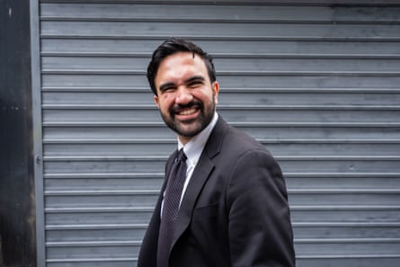 Man smiles and looks to side