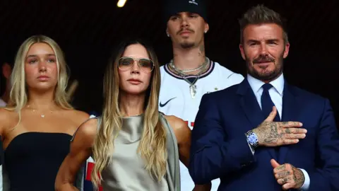 Getty Images The Beckhams watching England v Norway